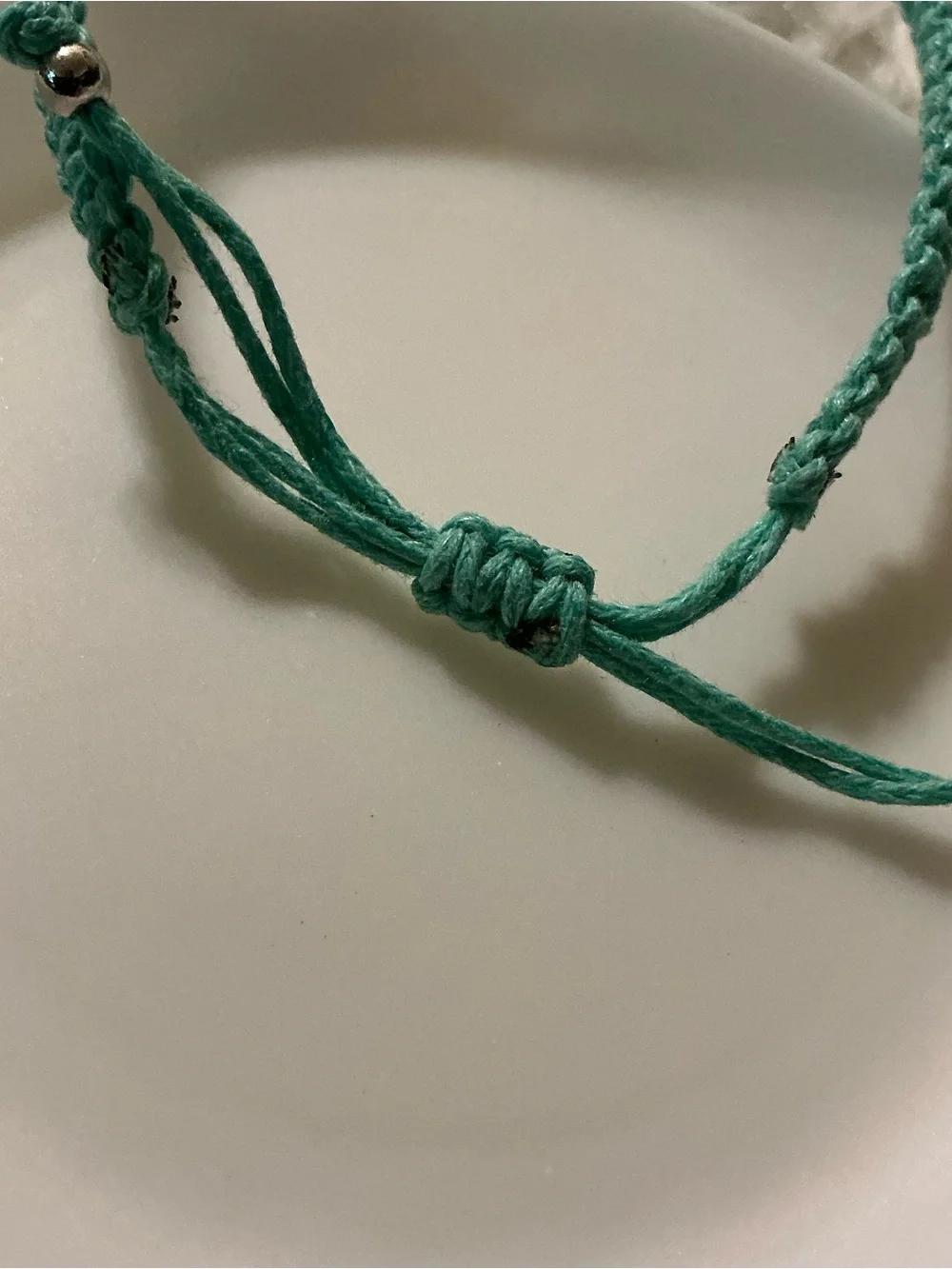 Pretty blue floral charm string bracelet